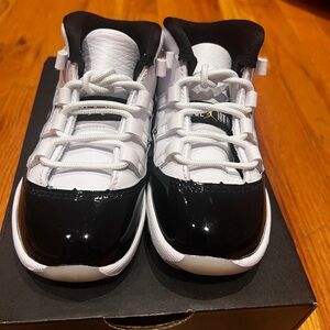 Never worn Toddler 11 Retro jordan’s size 7C white and black.